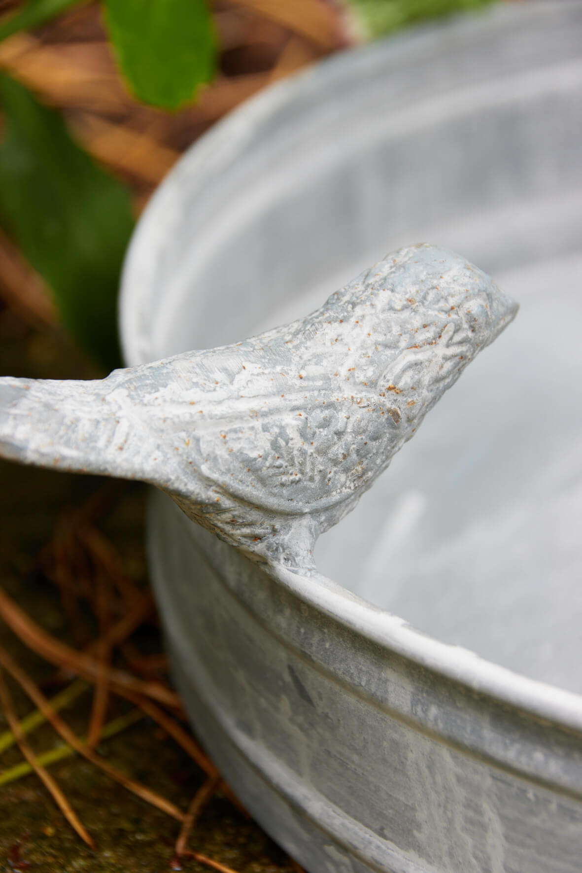 Vintage Style Bird Bath - Aged Zinc bird close up.