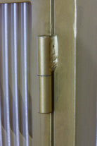 Industrial Fluted Glass Bathroom Cabinet - Antique Brass - close up of hinge