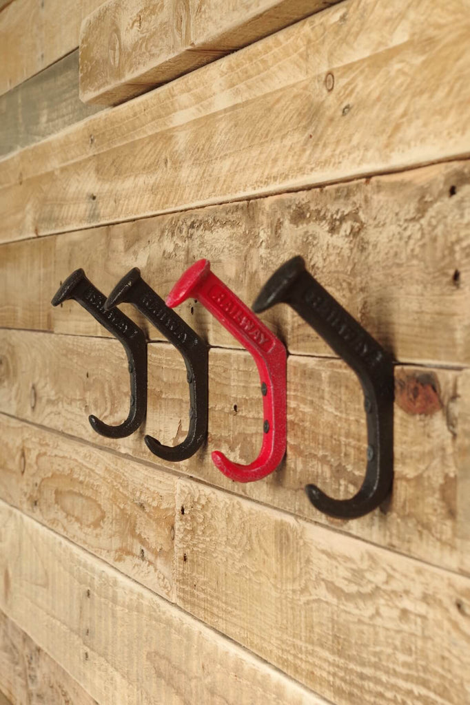 Cast iron coat hooks embossed with the word railway