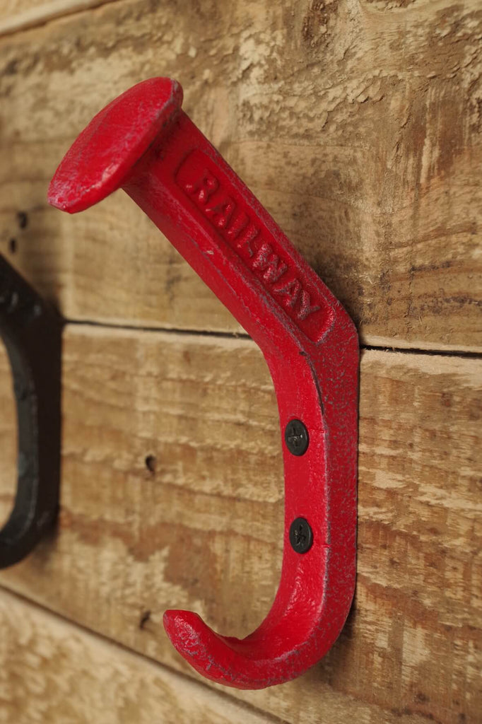 Cast iron coat hooks embossed with the word railway